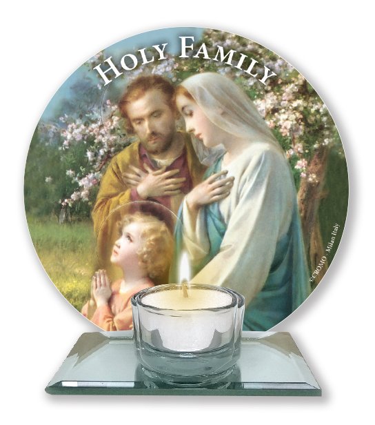 A glass votive light holder, with round image of the Holy Family.