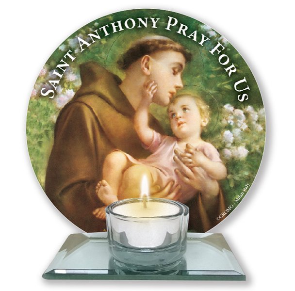 A glass votive light holder, with round image of Saint Anthony.