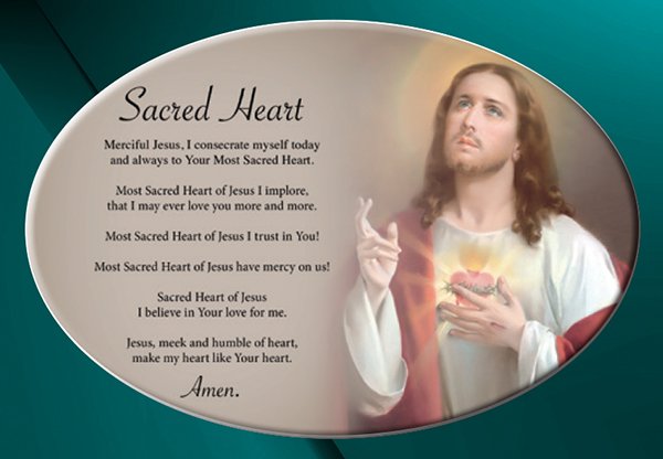 A ceramic oval plaque with image of the Sacred Heart with prayer.